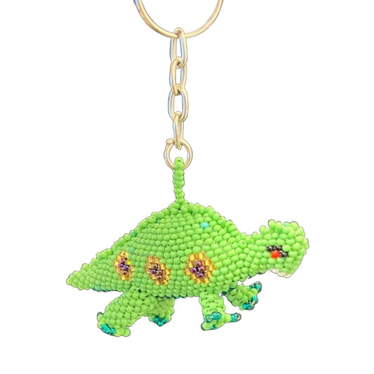 TRIBAL ROOTS Spotted Dinosaur Keychain